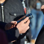 Man holding breathalyzer in hands after taking test and suspected of dui Man holding breathalyzer in hands after taking test and suspected of dui