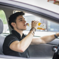 Boy drinking & driving