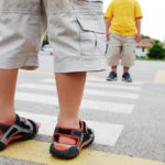 Little boy using crosswalk Little boy using crosswalk