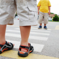 Little boy using crosswalk Little boy using crosswalk