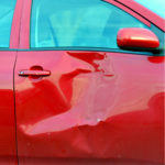 red vehicle hit on its side red vehicle hit on its side