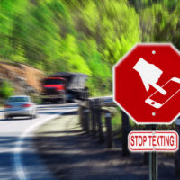 Red sign that says stop texting.jpg.crdownload