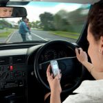 A lady on her phone & driving A lady on her phone & driving