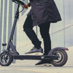 Close up image of a man on an electric scooter Close up image of a man on an electric scooter