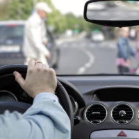 The driver and a pedestrian at a crosswalk The driver and a pedestrian at a crosswalk