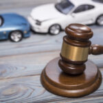 hammer of the judge. two collided cars, accident. hammer of the judge. two collided cars, accident.