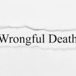 Wrongful Death on white torn paper Wrongful Death on white torn paper