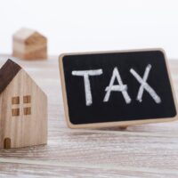 Houses with tax sign Houses with tax sign