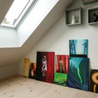 Home interior. Art collection in modern attic / loft apartment.