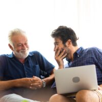 Father and son family time together at home concept. Smiling old Father and son family time together at home concept. Smiling old