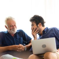 Father and son family time together at home concept. Smiling old