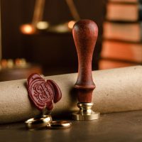 Notary public tools. Old stamp and document close-up. Notary public tools. Old stamp and document close-up.